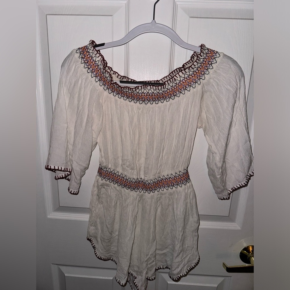 Cream romper with sleeves